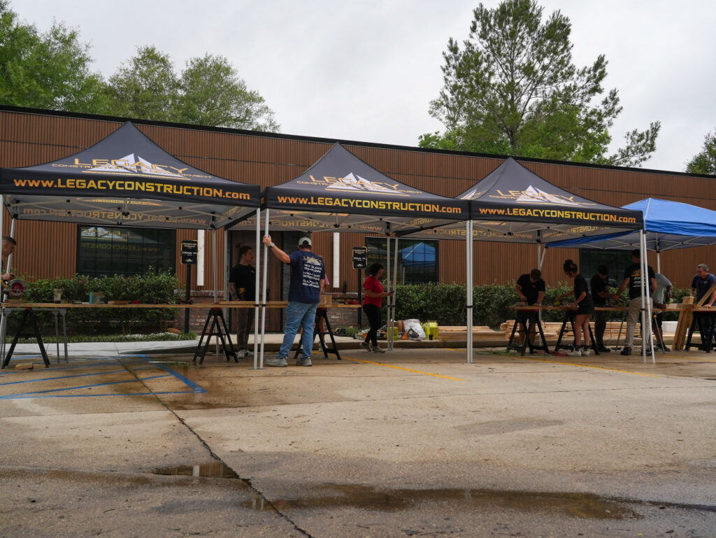 Impact Day 2026: Building More Than Beds 2 Legacy Construction and Development volunteers gather at the start of Legacy Day 2026 to build beds for children survivors of human trafficking